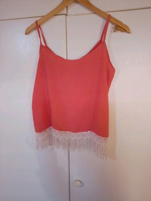 Blouse new with bow back and fringes bottom size L