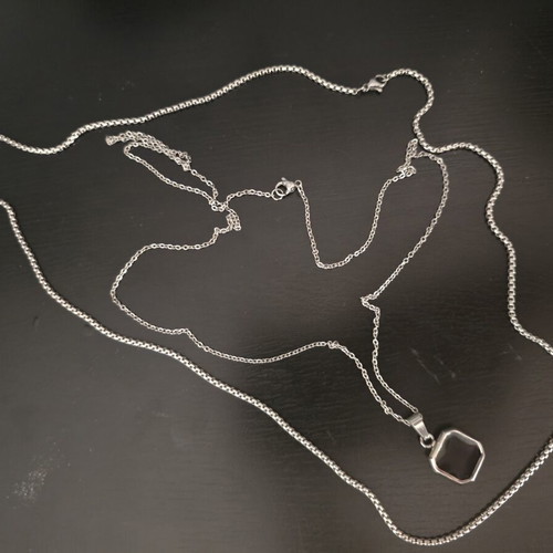 Silver necklace with geometric pendant and black stone, like new