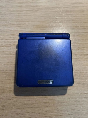 Game Boy Advance SP cobalt blue used with charger and NES Classics cartridge