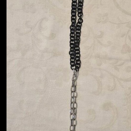Modern necklace with black chain and angel wing pendant with rhinestones