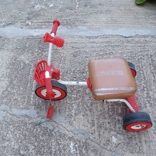 Red children's tricycle with extra foam seat