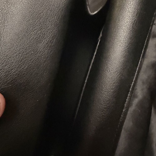 Minimal black handbag with unique closure like new