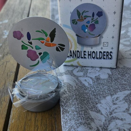 Metal candle holder with stained glass design