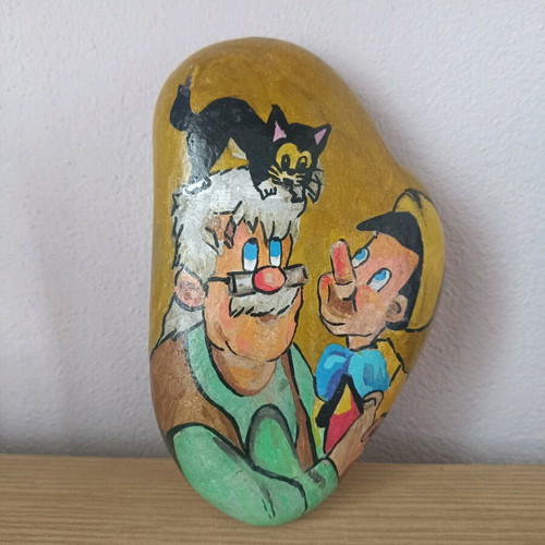Painted stone new with acrylic colors and glossy varnish