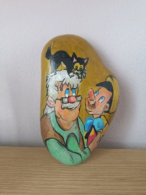 Painted stone new with acrylic colors and glossy varnish