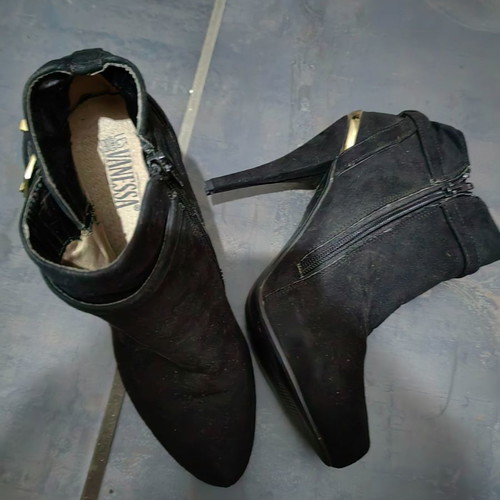 High-heeled ankle boot used, black with gold details