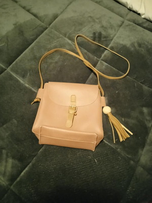 Women’s beige crossbody bag like new with tassel and decorative buckle