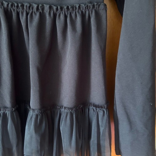 Women's blouse like new, black with tulle ruffles