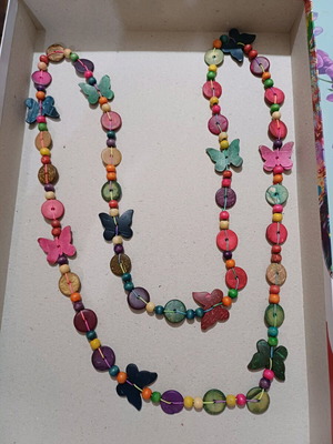 Wooden very long necklace with butterflies used