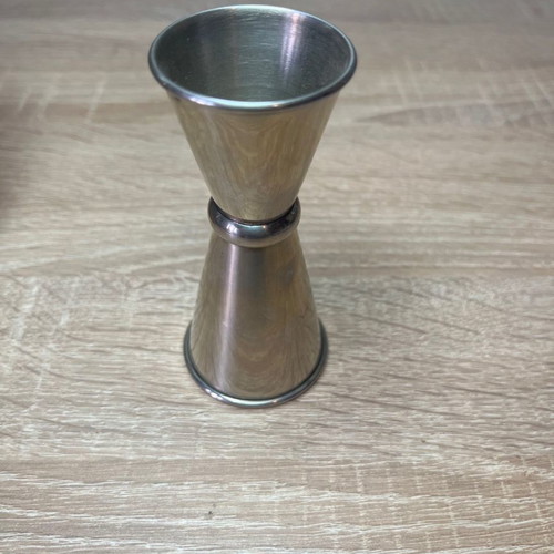 Cocktail shaker and jigger used, stainless steel