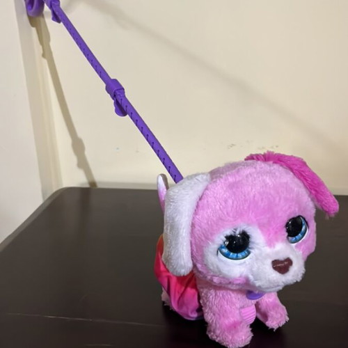 Interactive pink puppy toy with leash used