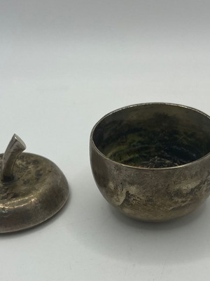 Small silver-plated apple-shaped case used