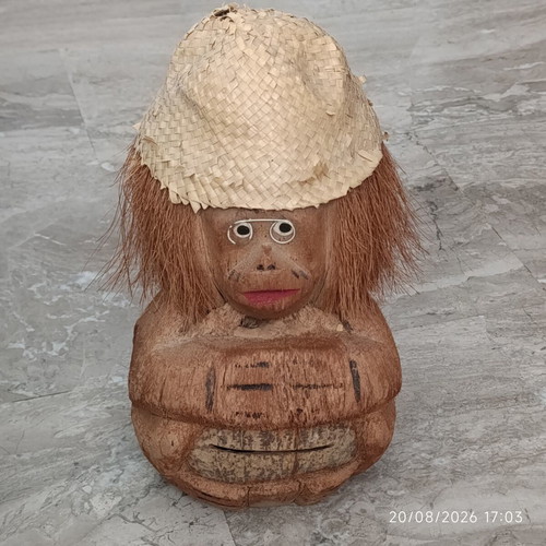 Handmade coconut shell money box with straw hat