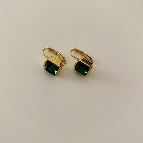 Earrings used, yellow color with green stone