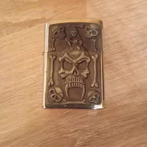 Oil lighter used carved with skull design