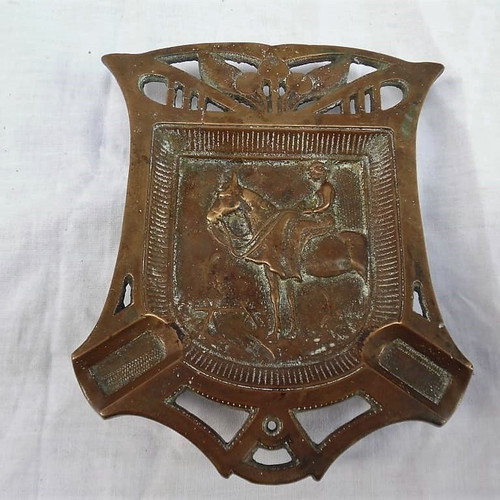Large solid brass carved ashtray with embossed figure