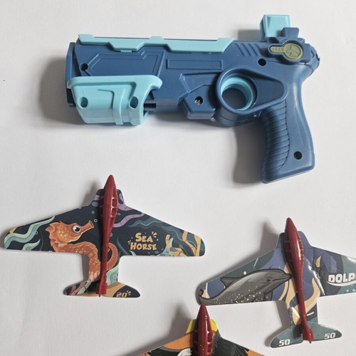 Children's toy gun with paper airplane launcher, new, set of 6 planes