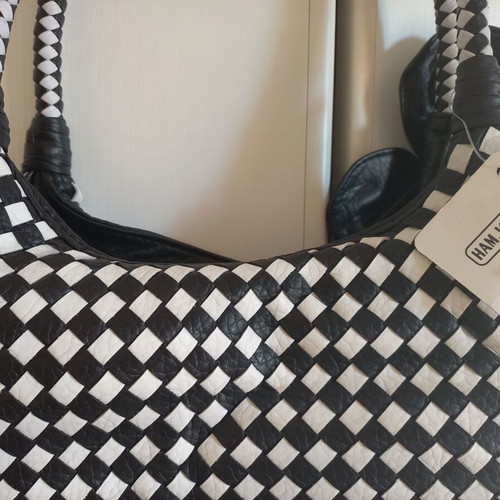 Black and white chic shoulder bag with flower detail