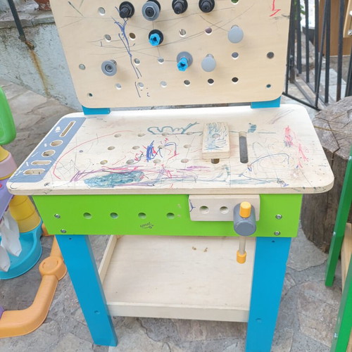 Children's wooden workbench used with tools