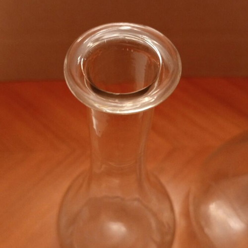 Vintage glass carafes with engraved floral design, pair
