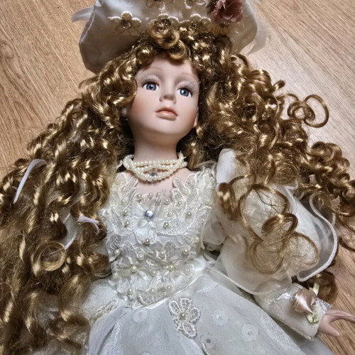 Glass Bride Doll like new with lace dress and hat