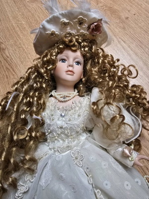 Glass Bride Doll like new with lace dress and hat