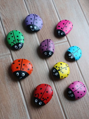 Set of 9 colorful hand-painted ladybugs, new