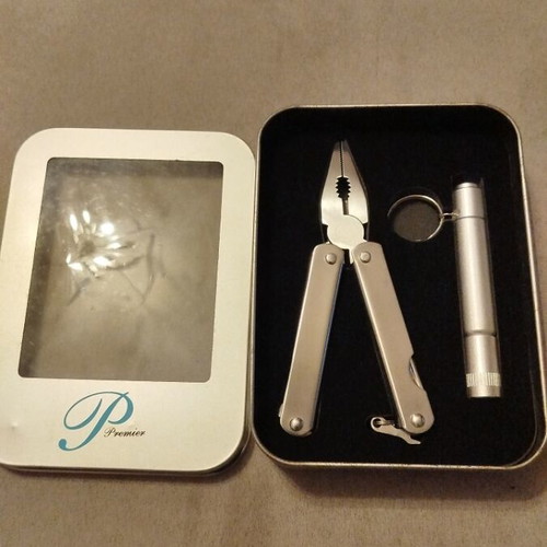 Multitool and flashlight set in metal box new unused