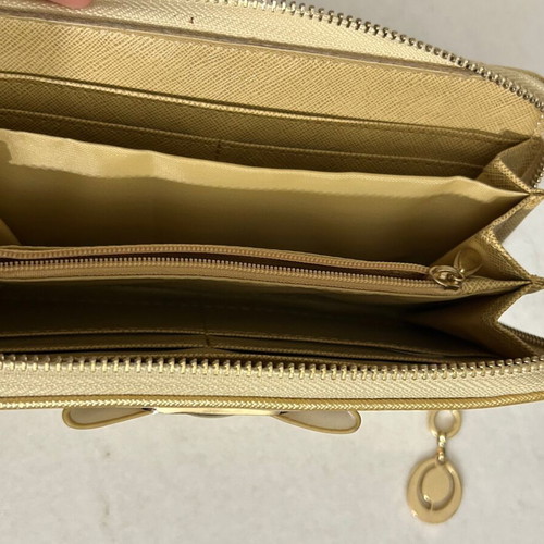 Two gold wallets, one with wrist strap