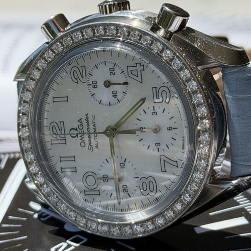 Omega Speedmaster 3835.70.36 watch like new, multicolor turquoise