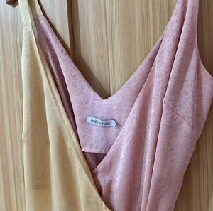 Milkwhite satin wrap-around maxi dress.