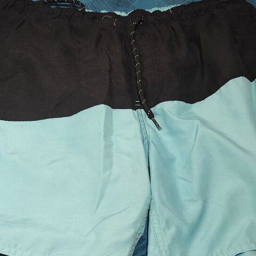 District swim shorts used, black and turquoise, size M, defect