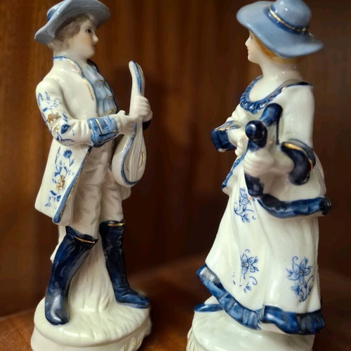 Porcelain figurine set used, woman with lyre and man with mandolin