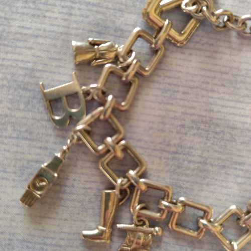 Burberry charm watch bracelet like new, silver plated finish