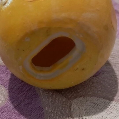 Ceramic piggy bank used with bottom opening