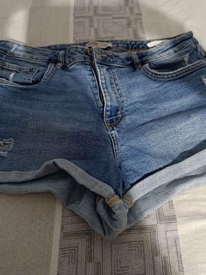 Denim shorts size 42 used, light blue with rips