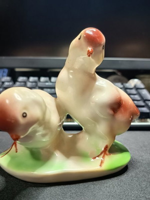 Porcelain vintage decorative figurine with two chicks like new
