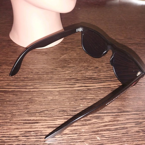 Unisex sunglasses used, matte black, with minor scratches