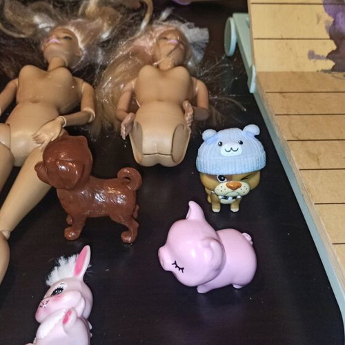Barbie and other toys used, in moderate condition