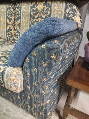 Two-seater sofa with storage compartment