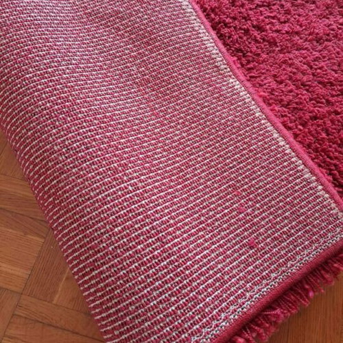 Shaggy red rugs with high pile, 2 rectangular and 1 round