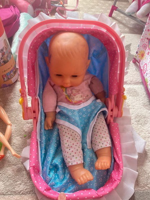 Doll with used carrying bag that fits on the back