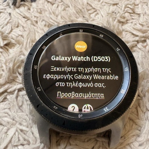 Samsung Galaxy Watch 46mm used with charger and 4 straps
