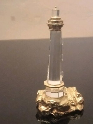 Swarovski decorative lighthouse like new, gold color