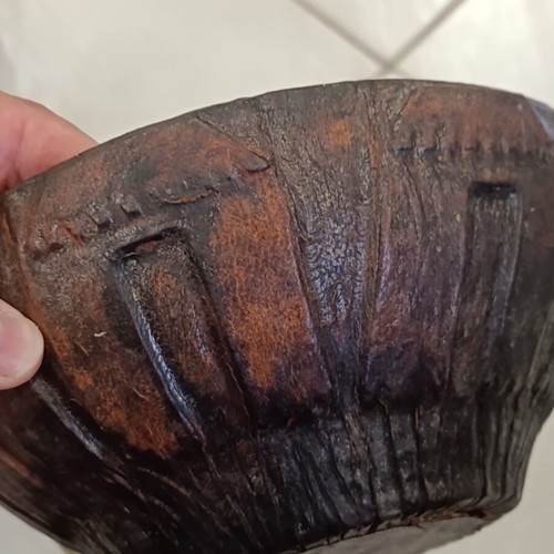 Antique wooden bowl with leather used