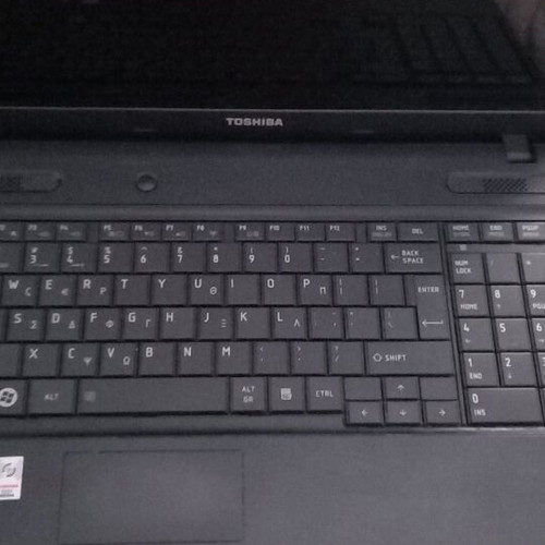 Toshiba Satellite C660D-10D laptop used with charger and accessories