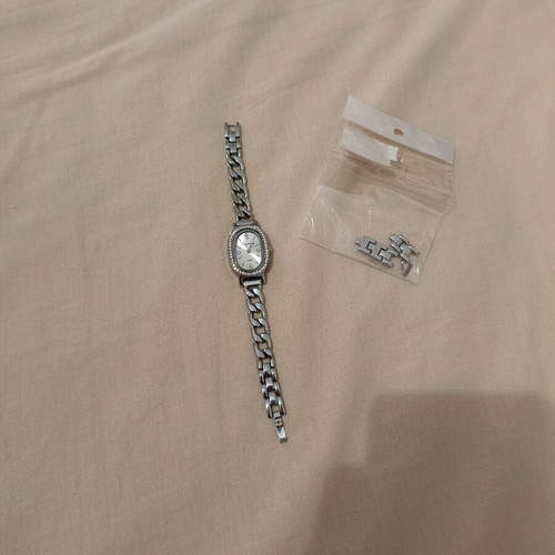 Women's silver watch like new with rhinestones and adjustable band