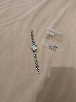Women's silver watch like new with rhinestones and adjustable band
