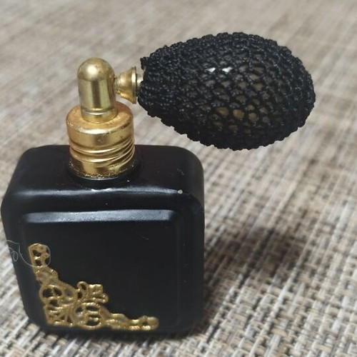 Vintage perfume bottle empty, like new, black with gold details