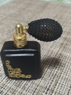Vintage perfume bottle empty, like new, black with gold details